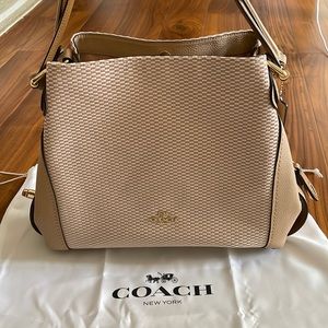 COACH Legacy Jacquard Canvas and Leather Edie shoulder bag.